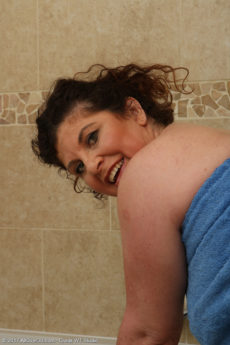 Mature busty BBW Jilly soaps up her chubby body in the bath and masturbates