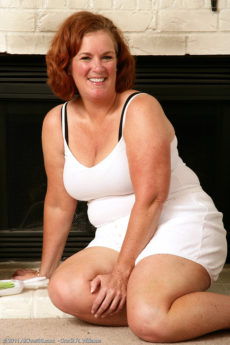 Fat red haired granny Lucy A lets us take a gander at her bushy pussy