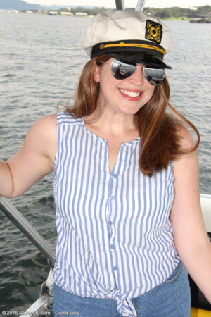 MILF with big tits naked on a boat
