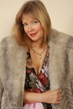 Elegant 52 year old Lilli showing strutting off her hot black stockings