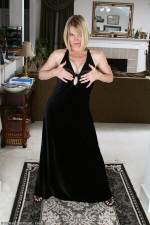 Elegant and mature Brittany slips of of her black dress in here
