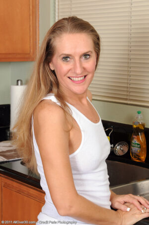 Hot blonde Sara J gives us a wet tshirt showing before showing all