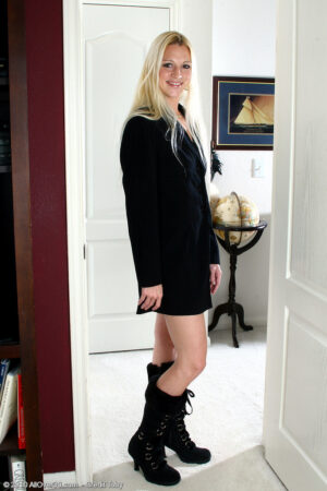 Long haired blonde Kyra spreads her legs to show her shaved pussy