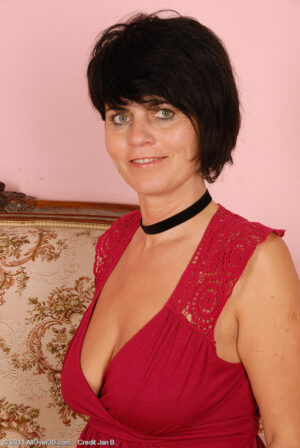 Horny 56 year old Eve keeps her boots on but spreads her shaved pussy